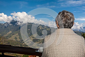 Senior woman tourist looking at the amazing landscapes of the Central Ranges on the ascent to the High of Letters between the