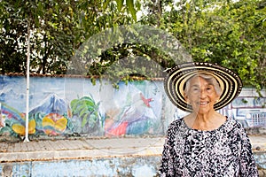 Senior woman tourist at the Macondo Linear Park in Aracataca the birthplace of Nobel Prize Gabriel Garcia Marquez