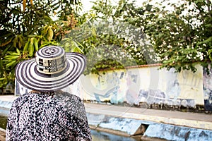 Senior woman tourist at the Macondo Linear Park in Aracataca the birthplace of Nobel Prize Gabriel Garcia Marquez