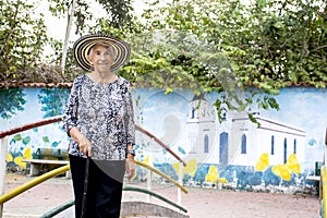 Senior woman tourist at the Macondo Linear Park in Aracataca the birthplace of Nobel Prize Gabriel Garcia Marquez