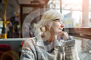 Senior Woman Traveling In Bus