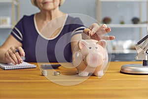 Senior woman trying to save up money, managing her budget and planning expenses