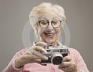 Senior woman using a digital camera