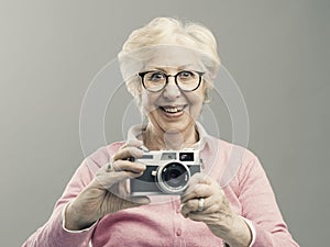 Senior woman using a digital camera