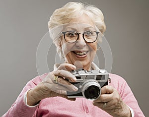 Senior woman using a digital camera