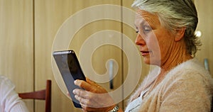 Senior woman using digital tablet 4k