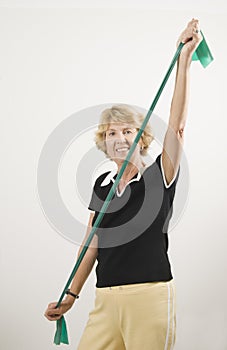 Senior woman using exercise band