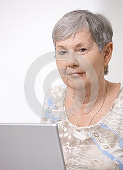 Senior woman using laptop computer