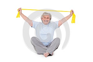 Senior woman using resistance band