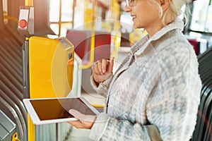 Senior woman validating a ticket