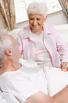 Senior Woman Visiting Her Husband In Hospital