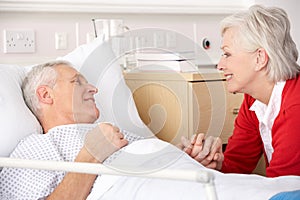 Senior woman visiting husband in hospital