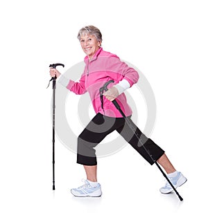 Senior Woman Walking With Hiking Poles