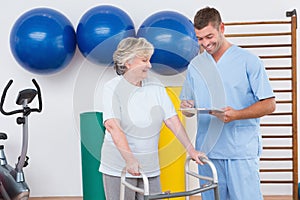 Senior woman walking with zimmer frame