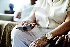 Senior woman watching a television