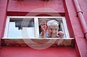 Senior woman waving her hand