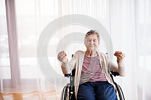 Senior woman in wheelchair at home.