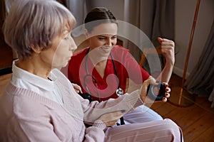 Senior woman in wheelchair working with her occupational therapist