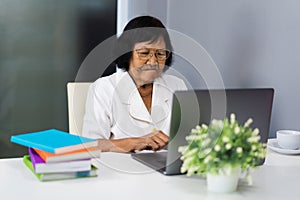 Senior woman working on laptop computer