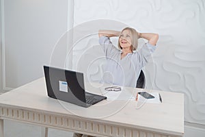 Senior woman working with laptop photo
