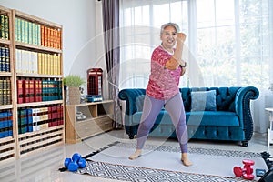 Senior woman workout with boxing jabs at home