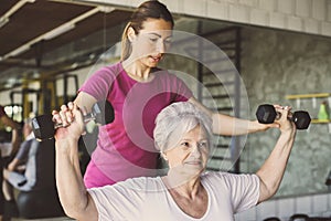 Senior woman workout in rehabilitation center.