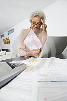 Senior Woman Worrying About Home Finances