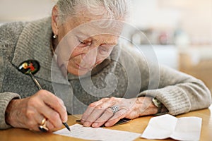 Senior woman writing photo