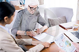 Senior woman writing testament