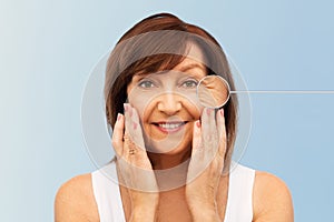 Senior woman with zoomed eye wrinkles in pointer