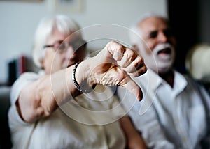 Senior woman disagrees sitting with husband