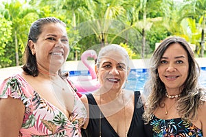 Senior Women Friends Portrait At Swimming Pool