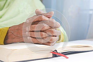 senior women hand on a bibel