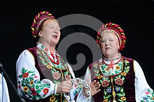 Senior women singing traditional ukrainian song at Day of Kiev holiday