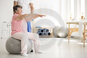 Senior woman maintaining balance photo