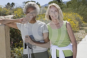 Senior Women Stand With Walking Poles