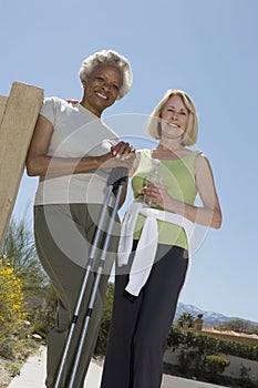 Senior Women Stand With Walking Poles photo