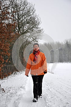 Senior women strawling in the winter snow