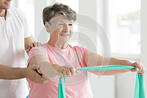 Senior woman during individual rehabilitation photo