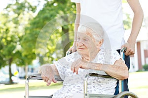 Senior Women in Wheelchair with Caretaker