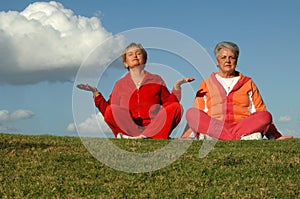 Senior women yoga outdoors