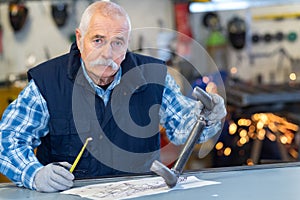 senior worker in metalworks factory