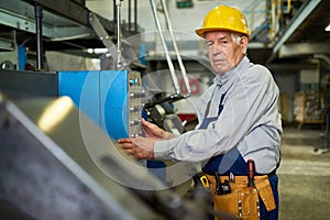 Senior Worker Operating Machine Units at Factory