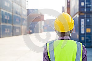 Senior worker vision looking at work place port shipping cargo container yard from back view with copy space