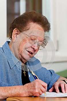 Senior writes a letter photo