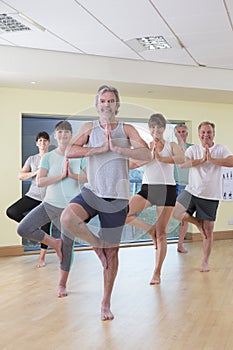 Senior yoga class posing photo