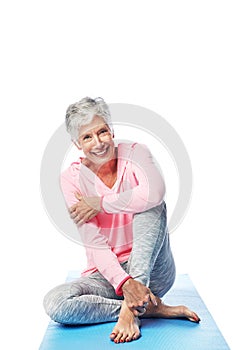 Senior, yoga and portrait of woman in studio isolated on a white background. Zen chakra, pilates fitness and retired