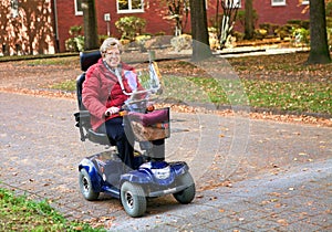 Seniorin with electric scooter