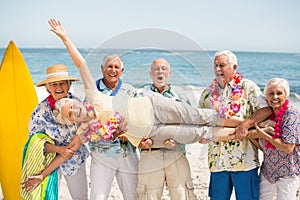 Seniors carrying senior woman