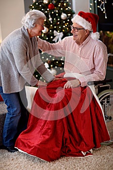 Seniors celebrating Christmas - lovely elderly couple